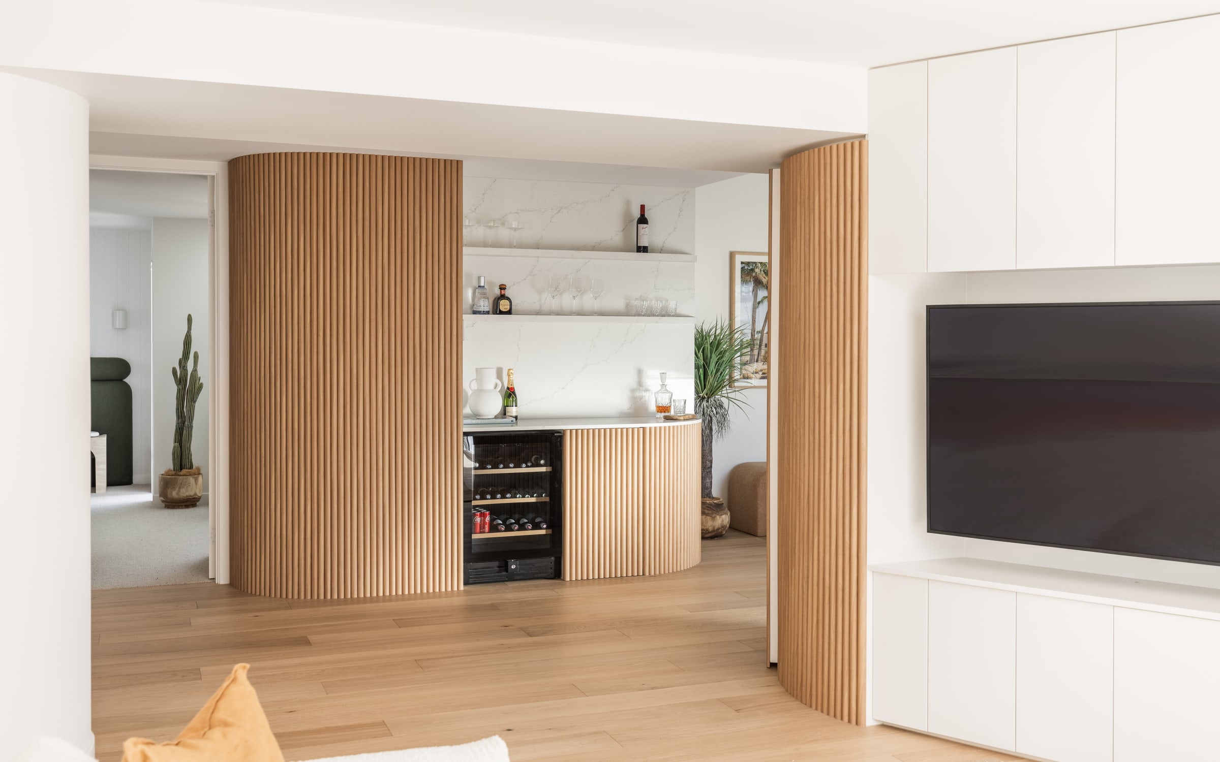 Custom fluted-oak home bar with integrated wine storage on the Gold Coast