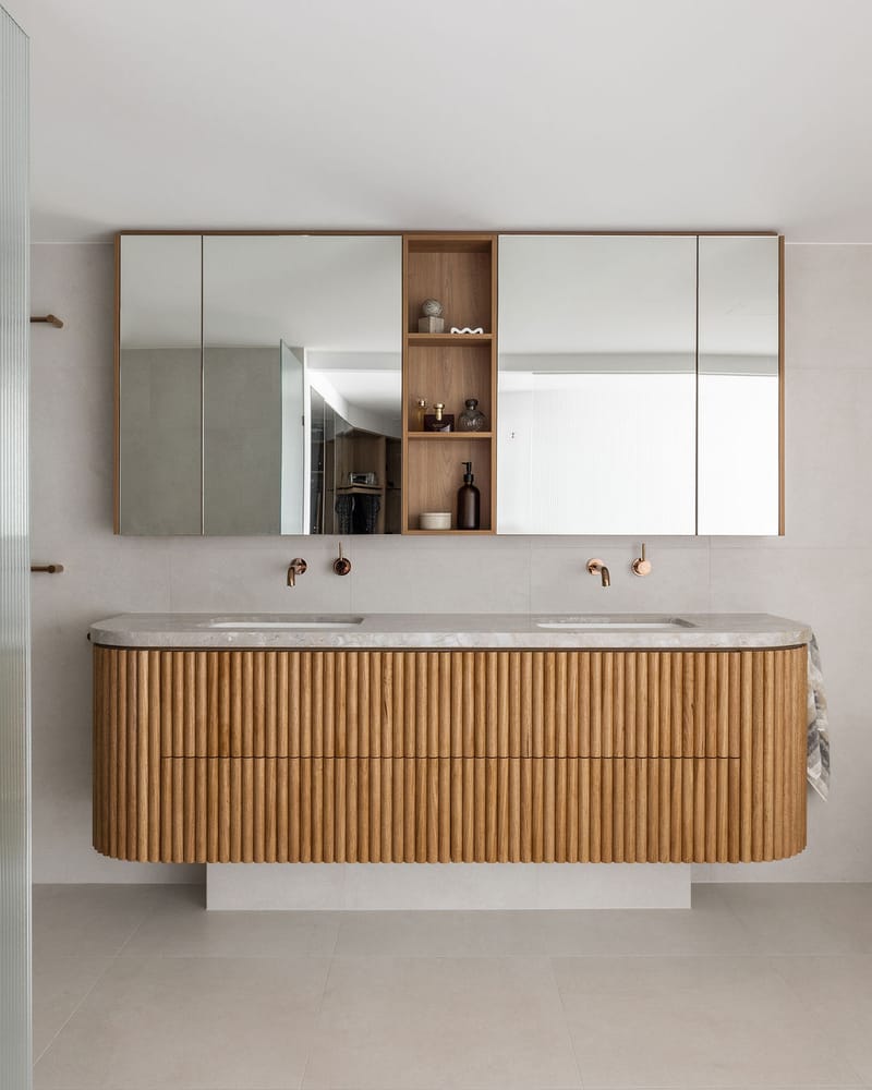 Curved fluted-oak bathroom vanity with marble top, Main Beach