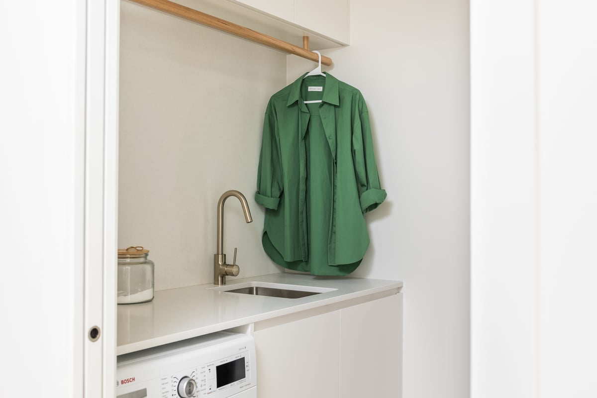 Custom laundry joinery installed alongside a builder
