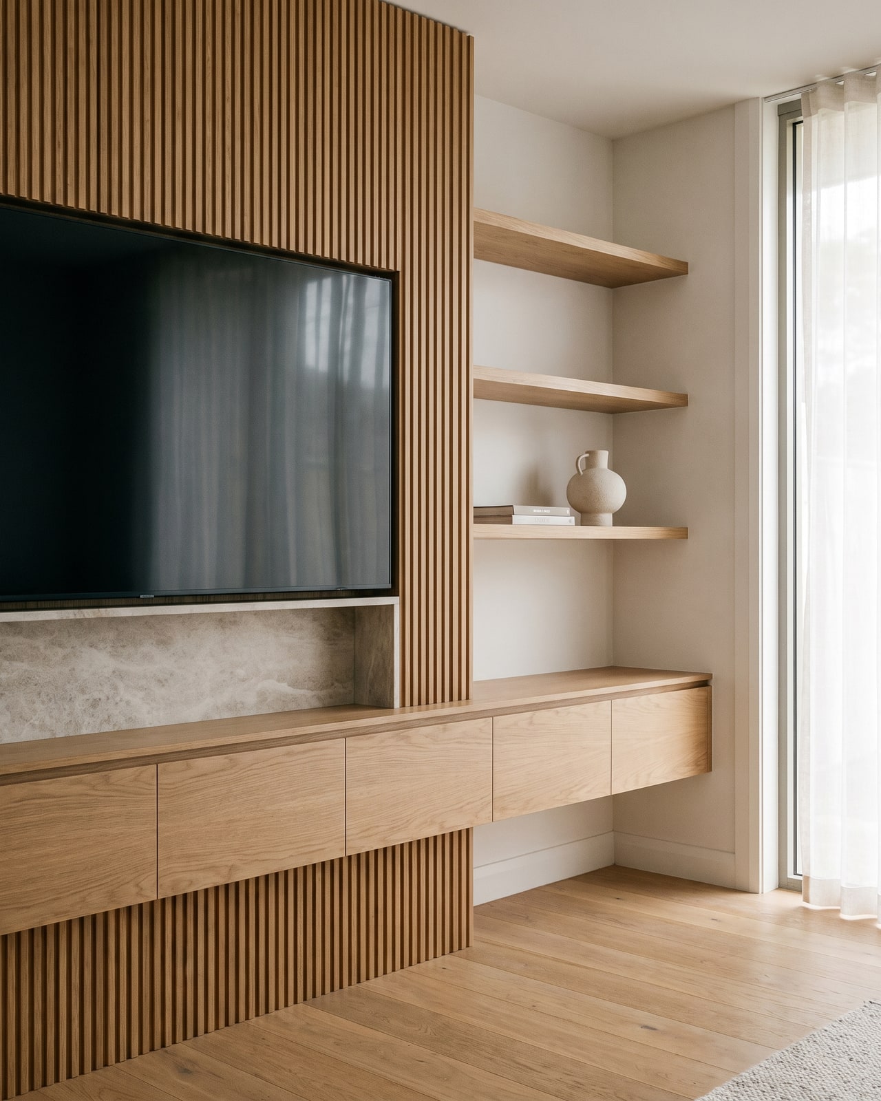 The finished custom fluted-oak media wall, built from the design