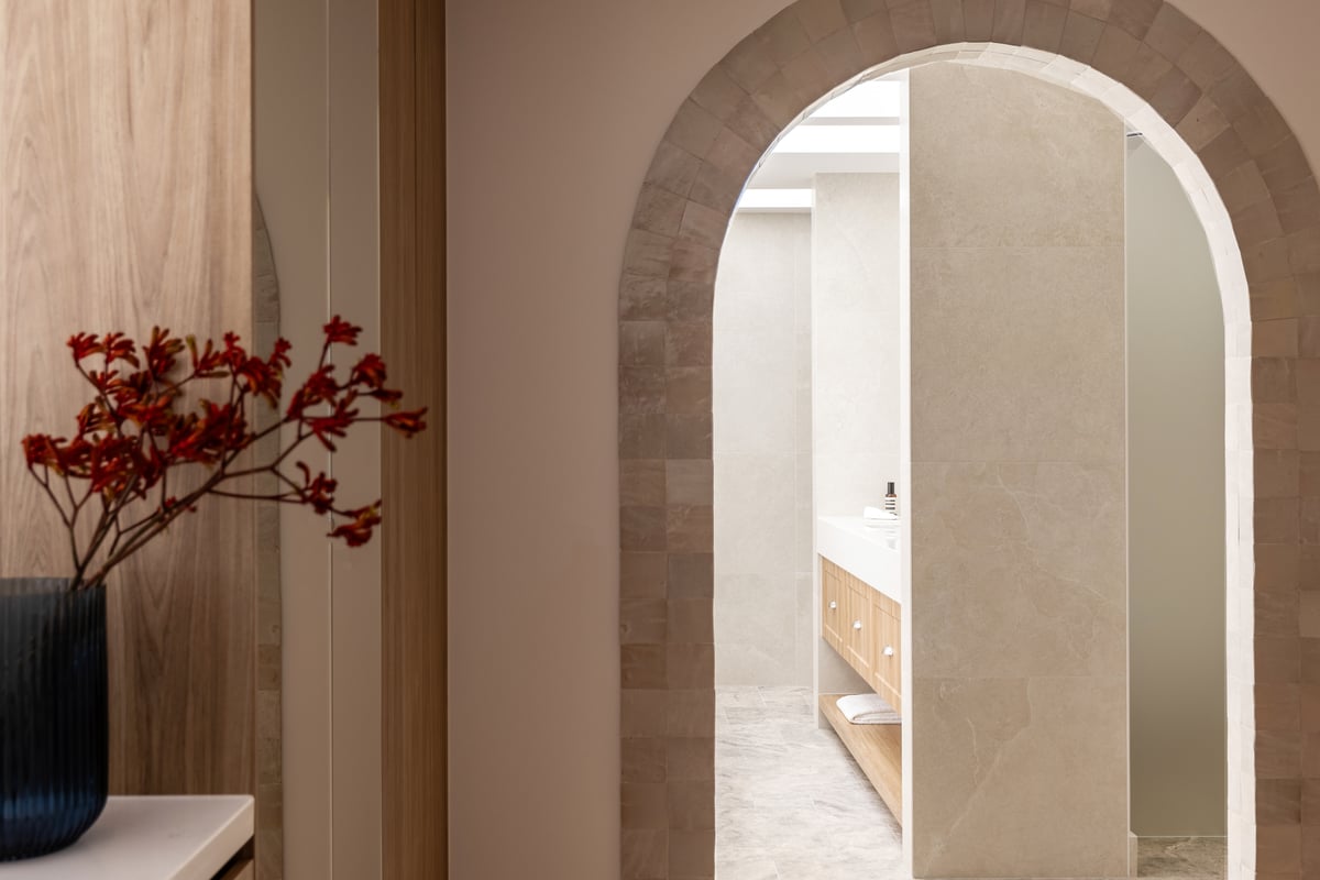 Custom walk-in robe joinery installed alongside a builder