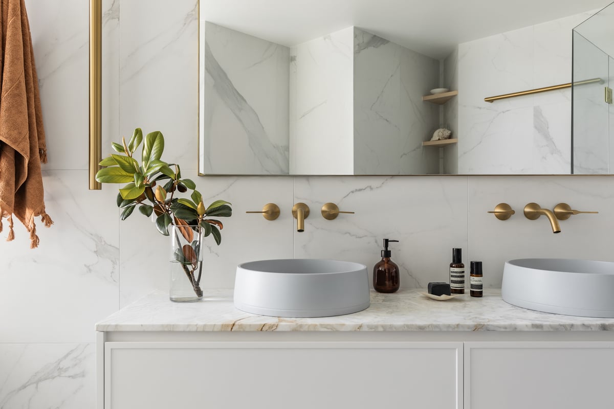 Custom bathroom vanity joinery installed alongside a builder