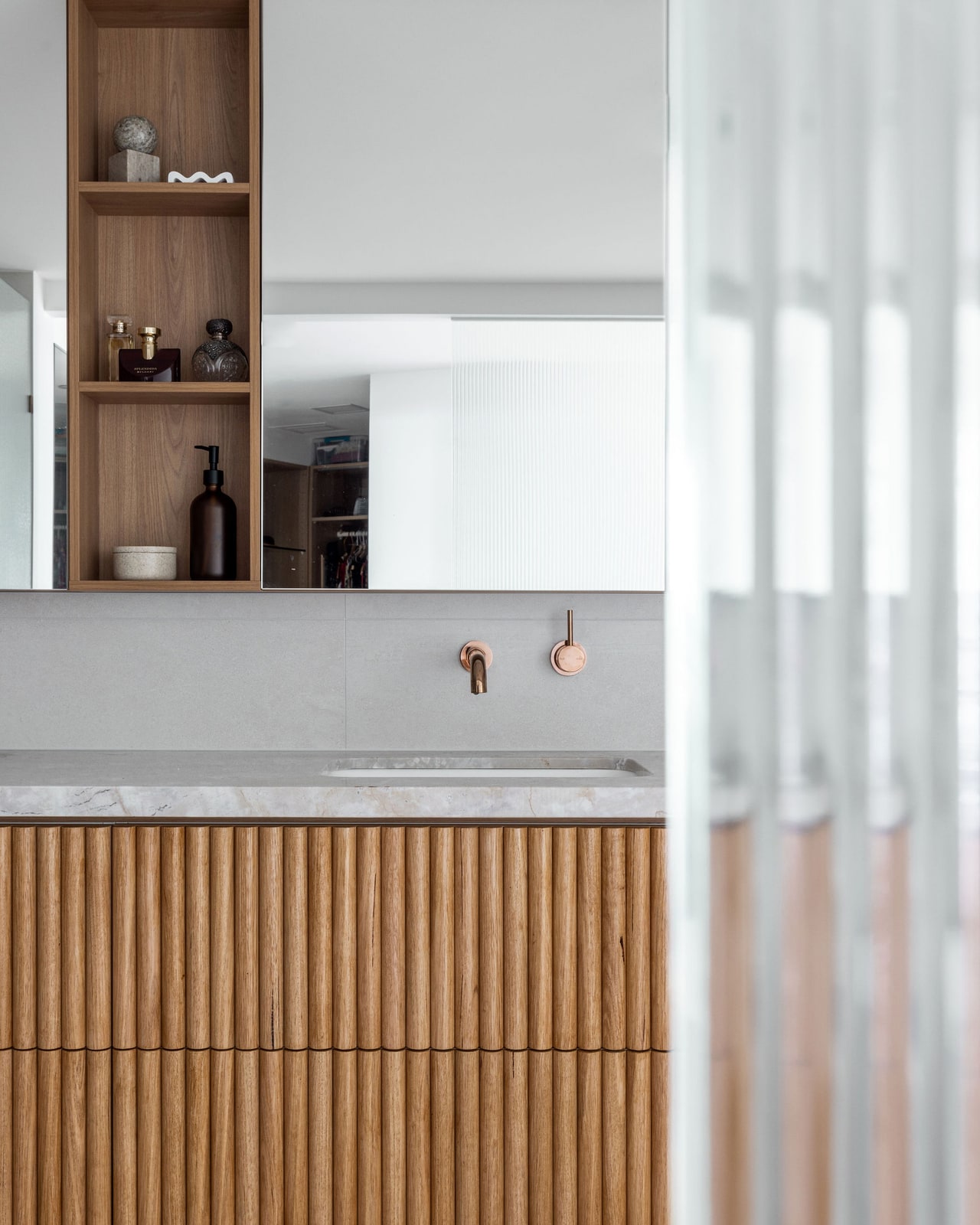 The finished curved fluted-oak bathroom vanity, built from the design - Main Beach